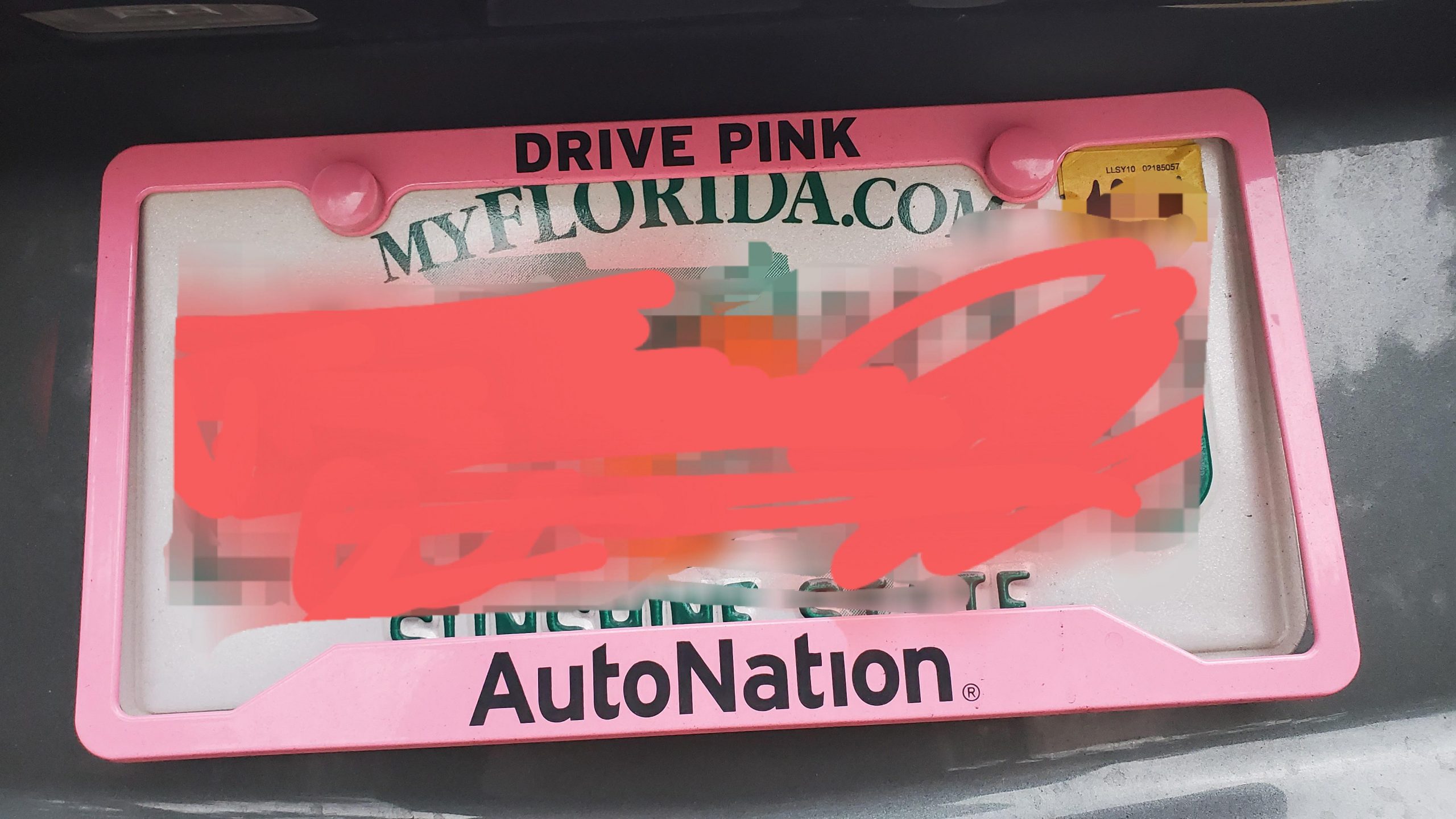 How do I remove the license plate frame without breaking my fingers?