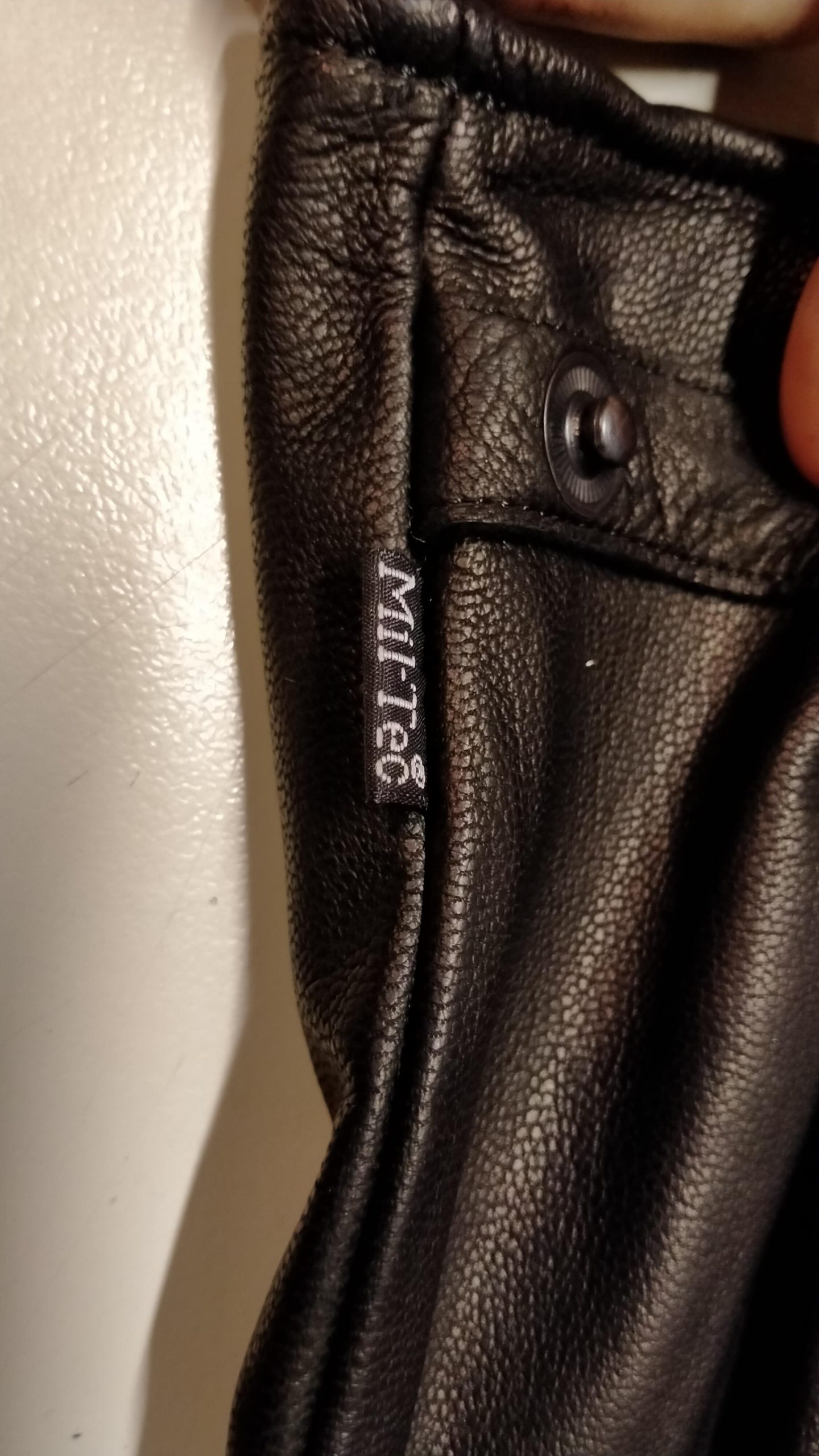 How to remove tag without damaging leather glove?