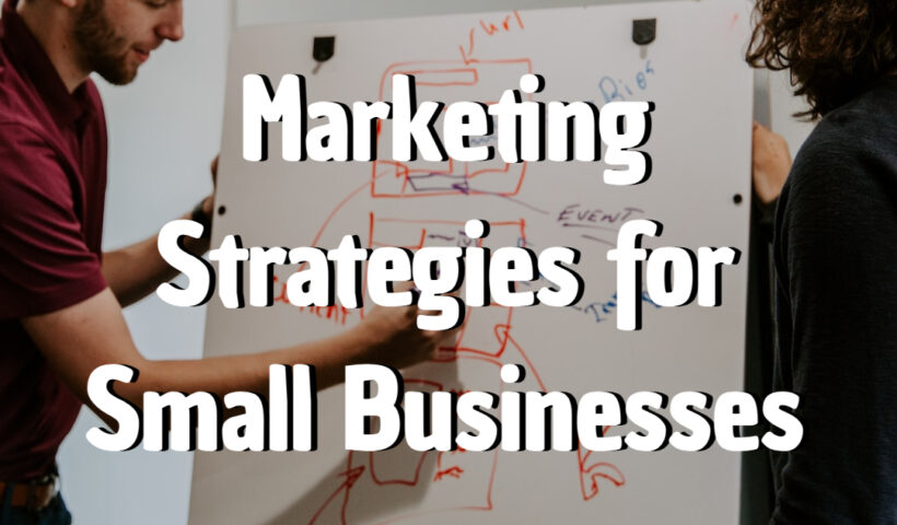 man drawing on dry-erase board Marketing Strategies for Small Businesses