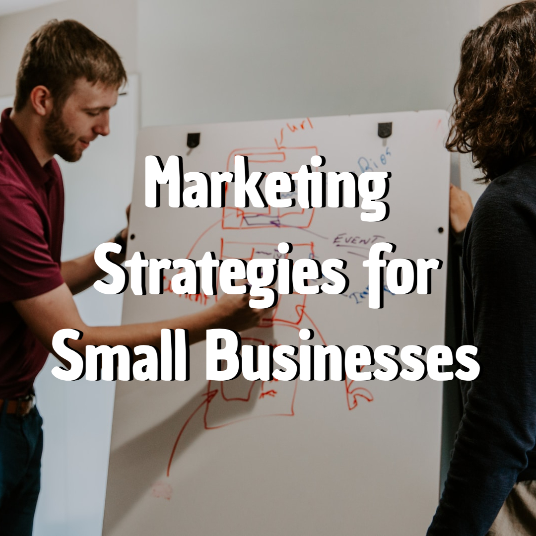 man drawing on dry-erase board Marketing Strategies for Small Businesses