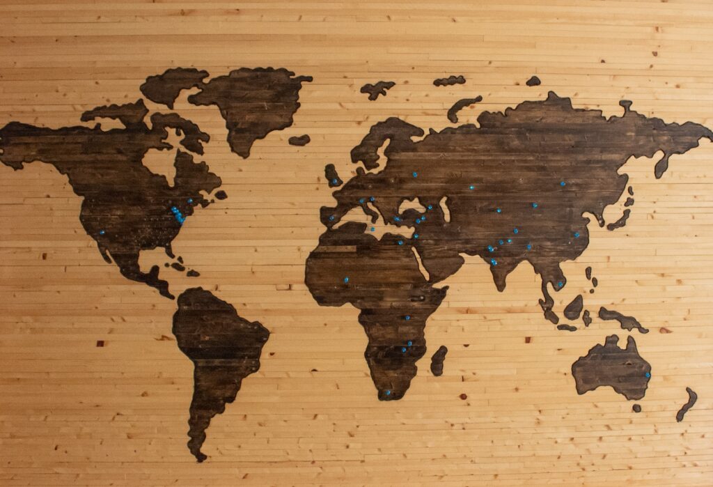 brown wooden map board - remote hiring