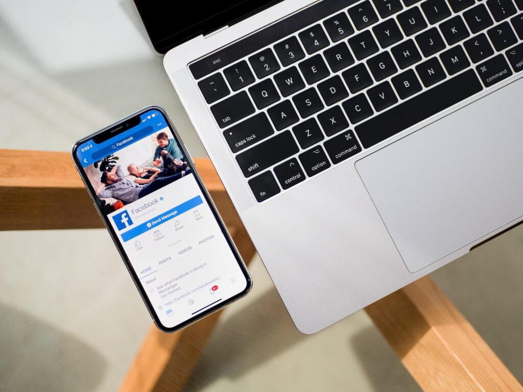 iPhone X beside MacBook - how to create a facebook business page