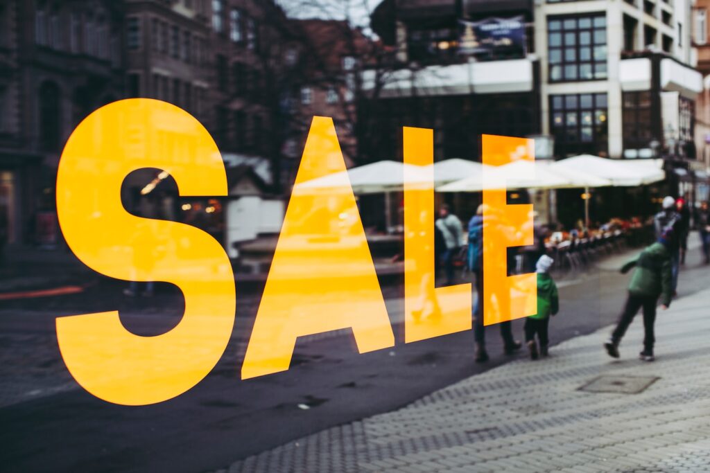 man in green jacket walking on sidewalk during daytime - Mastering the Art of Sales