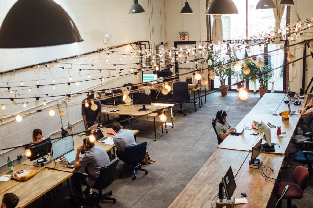 people sitting in front of computer monitors employee benefits